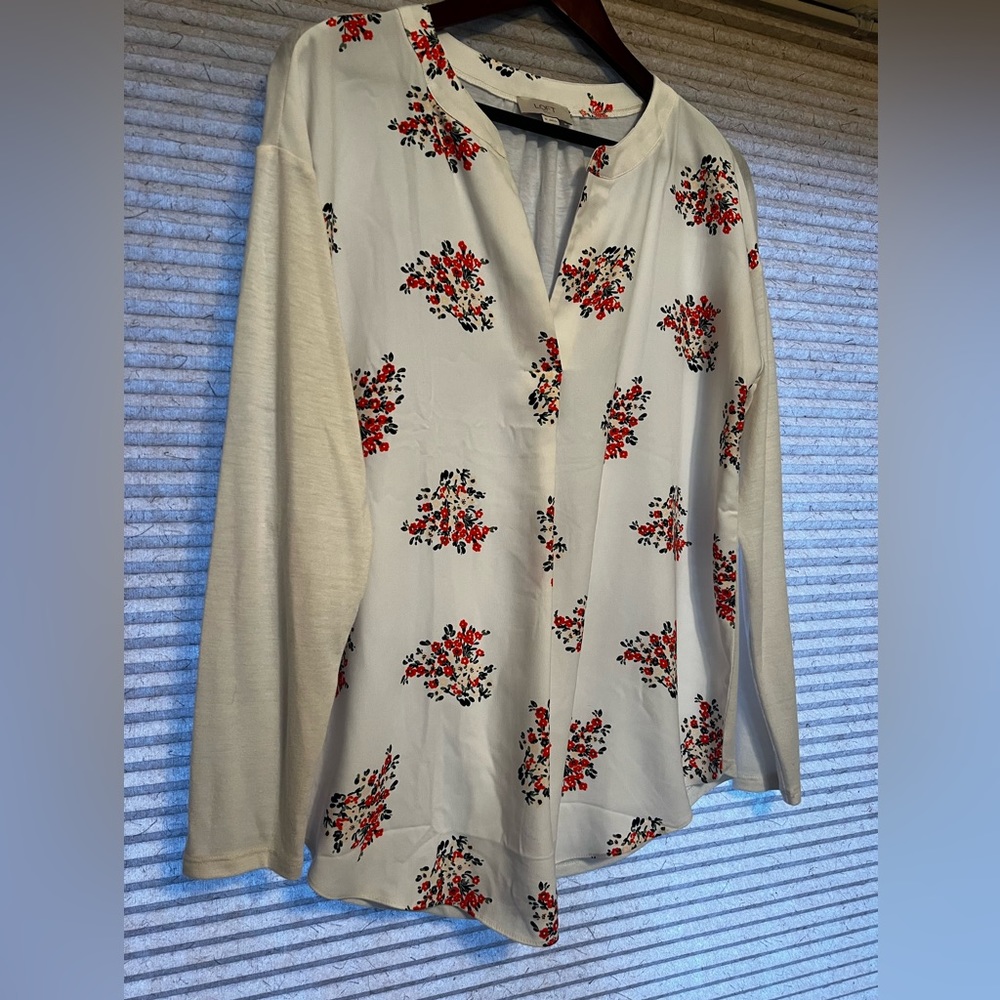 Ann Taylor Loft top with flowered front and plain back and sleeves.